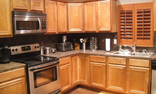 Kitchen Grey Wall Paint And Brown Wooden Oak Cabinet On Laminate throughout size 4000 X 3000