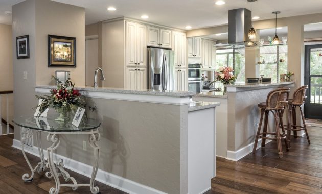 Open Kitchen In Cream Colored Cabinets Wood Floors Stainless Steel inside sizing 1500 X 1125