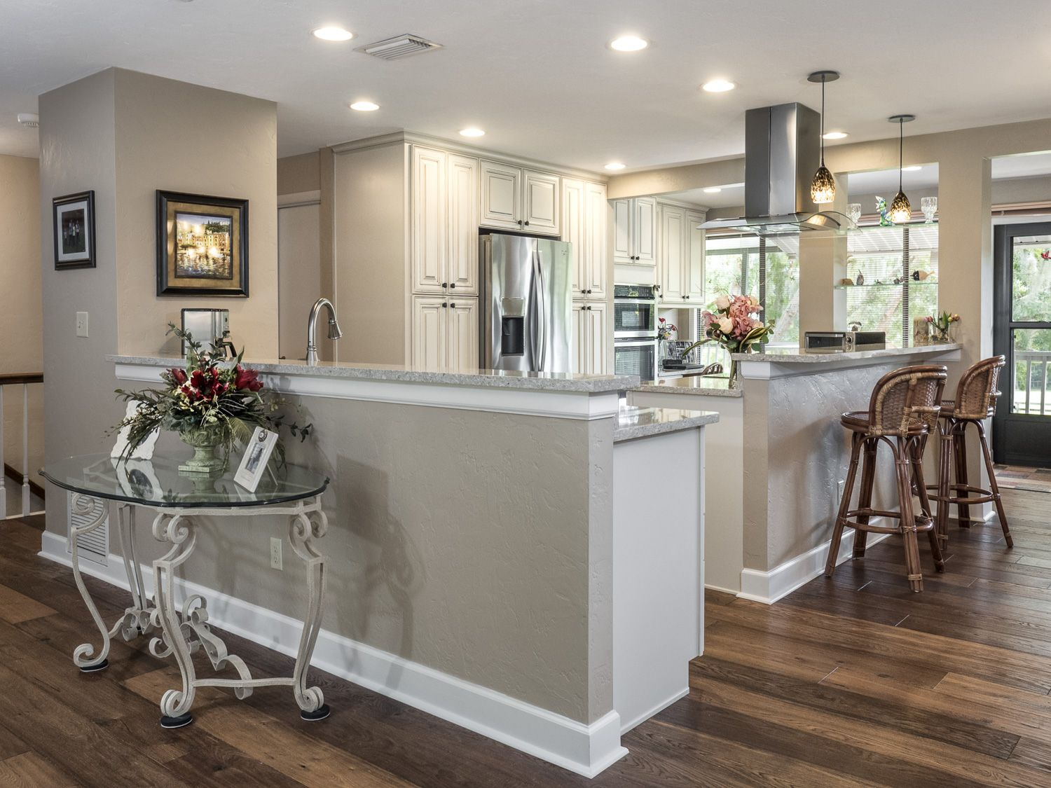 Open Kitchen In Cream Colored Cabinets Wood Floors Stainless Steel inside sizing 1500 X 1125