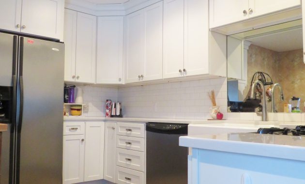 Small White Kitchen Made Bigger A Mirror Cabinetry Homecrest within measurements 3888 X 5184