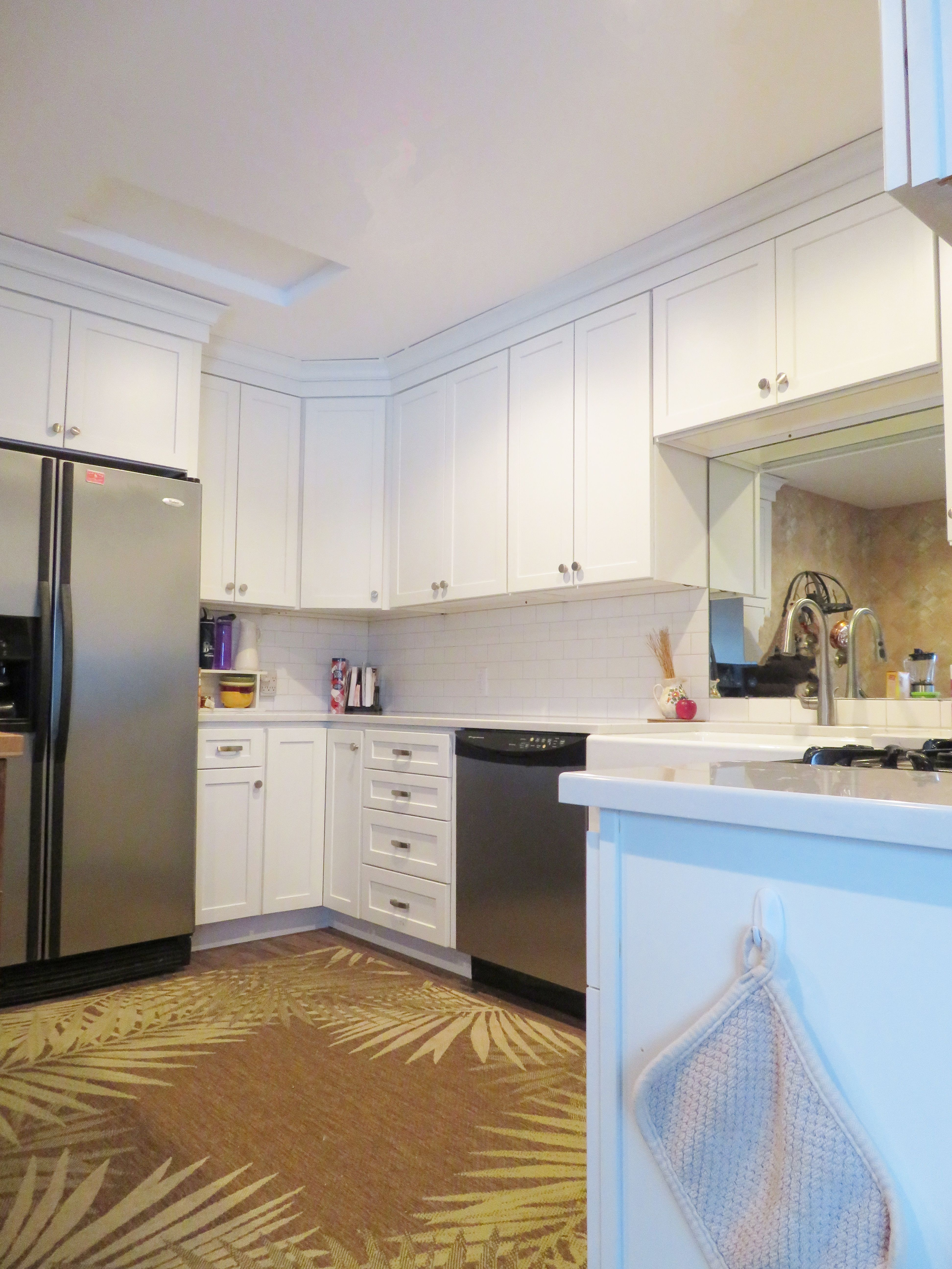 Small White Kitchen Made Bigger A Mirror Cabinetry Homecrest within measurements 3888 X 5184