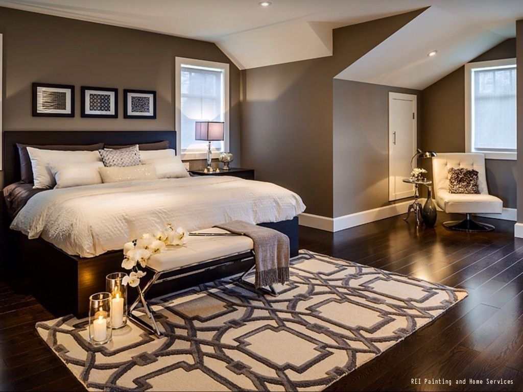 A Warm And Cozy Bedroom With Dark Hardwood Floors And Brown Paint intended for sizing 1024 X 768