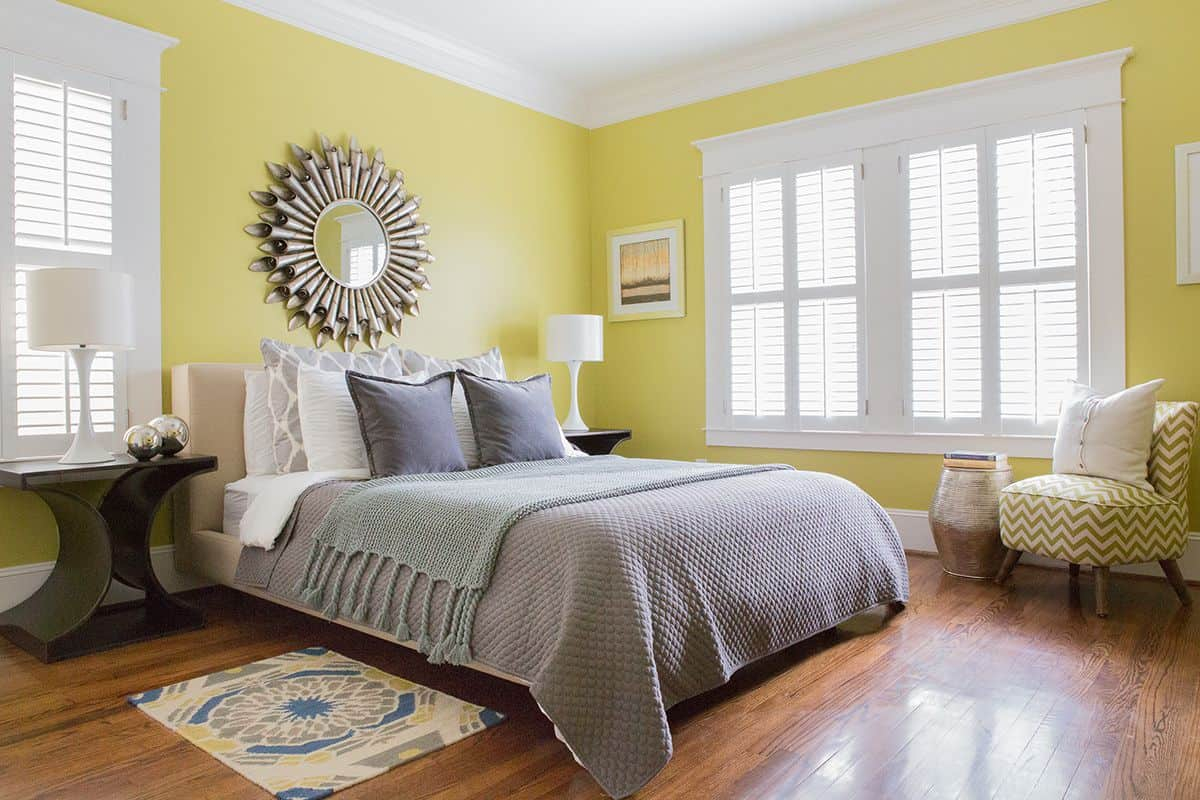 Bedroom With Yellow Warm Paint Colors And Wall Mirror Warm Paint regarding sizing 1200 X 800