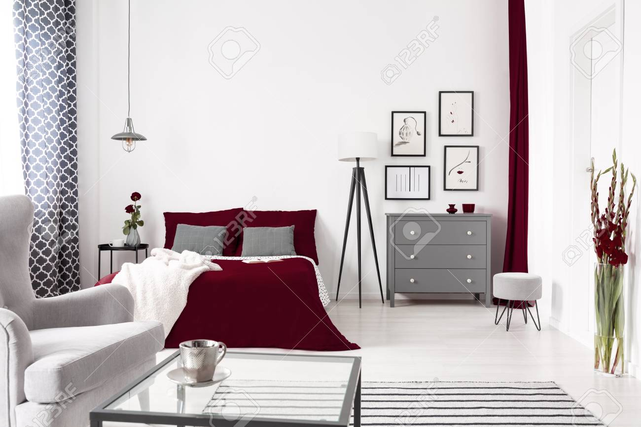 Glamour Bedroom Interior In White Gray And Burgundy With A Bed in sizing 1300 X 866