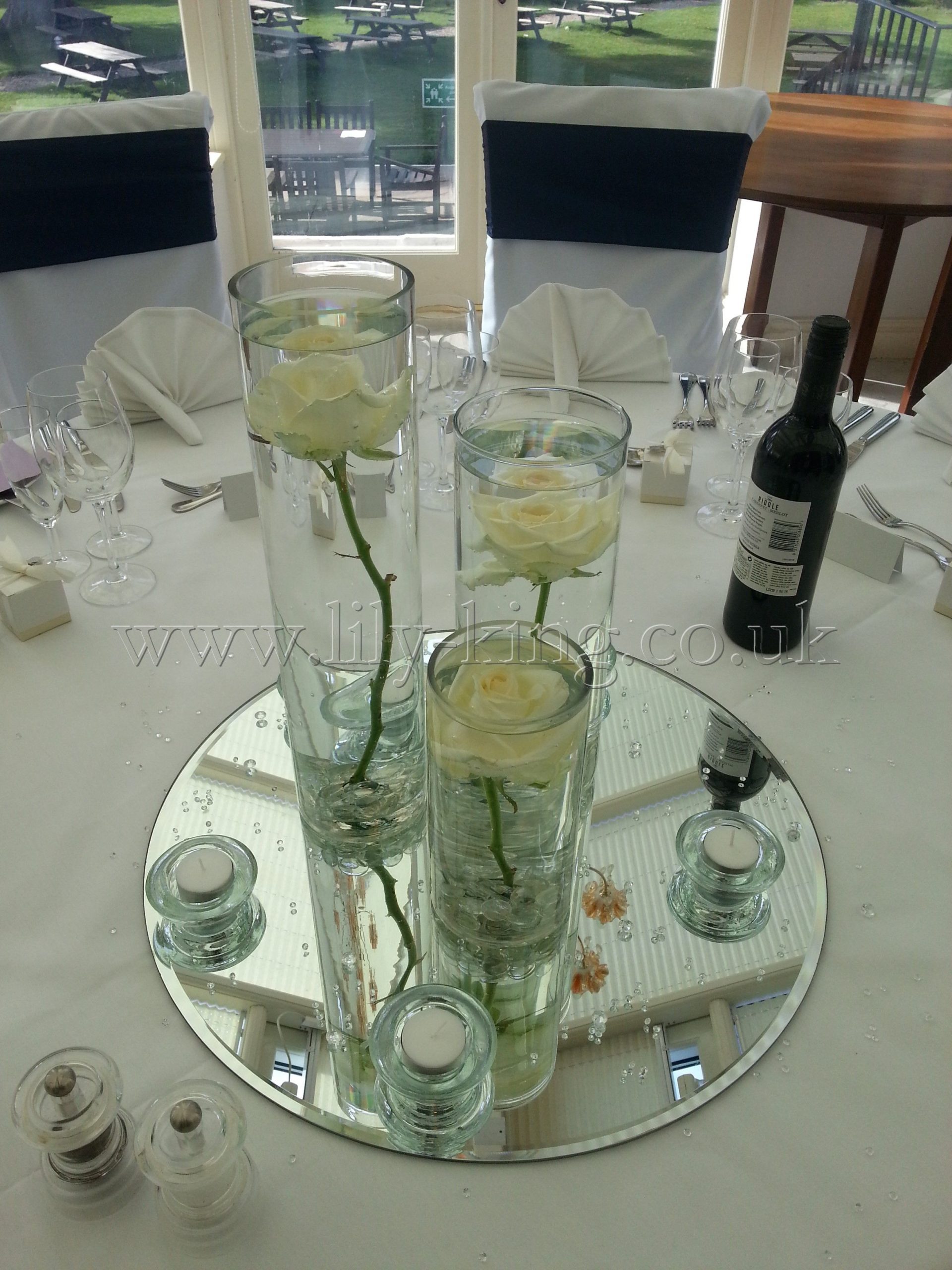 3 Cylinder Vases Of Varying Heights With A White Rose with regard to proportions 2448 X 3264