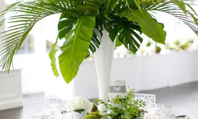 A Tall Cylinder Vase Spilling With Large Green Monstera with sizing 750 X 1125