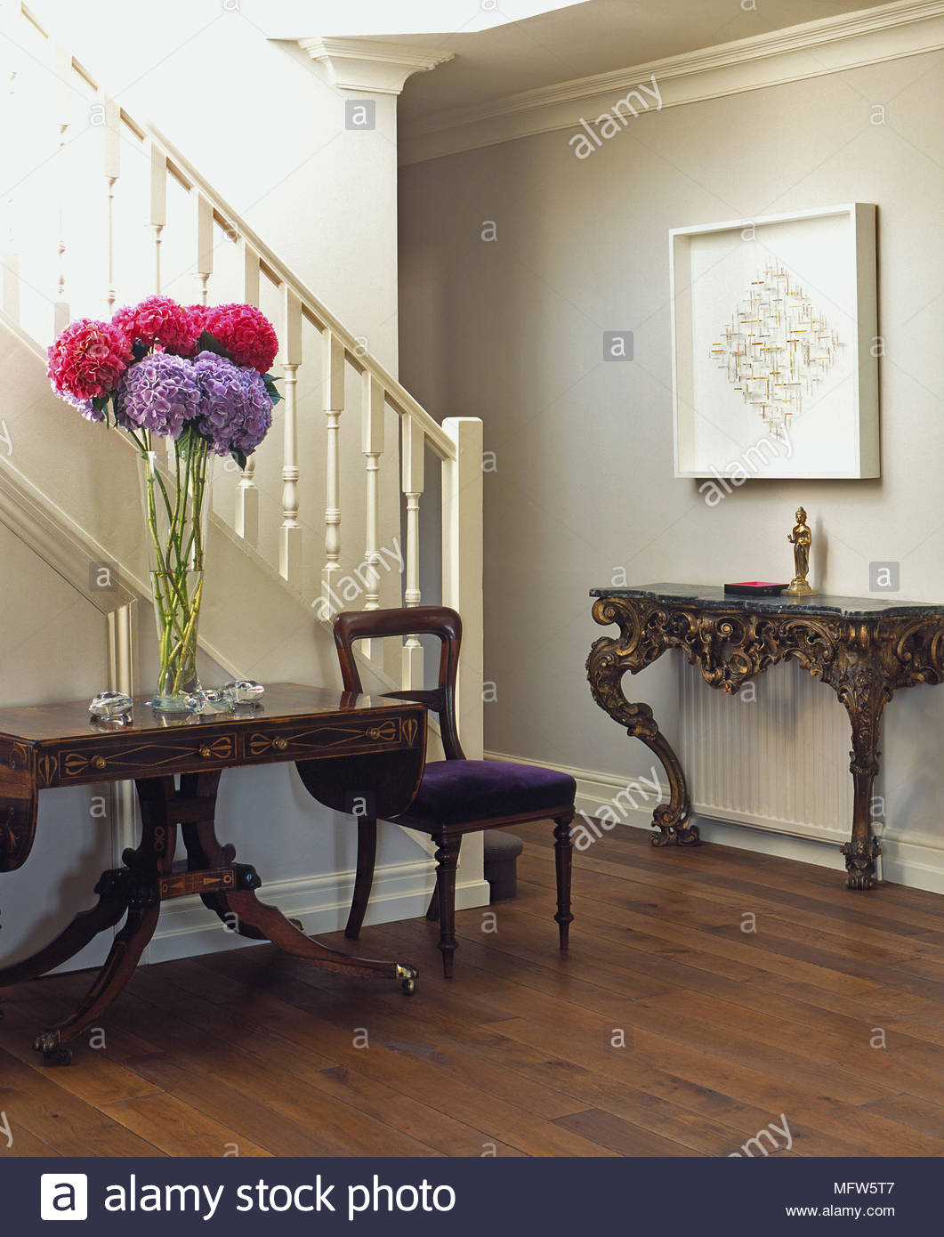 A Traditional Hallway With A Large Vase Of Flowers On A inside sizing 1061 X 1390