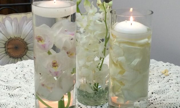 A Trio Of Cylinder Vases Using White Dendrobium Orchids inside proportions 852 X 1136