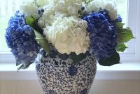 Beautiful Blue White Floral Arrangement In A Ginger Jar in size 3024 X 4032