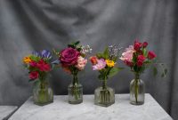 Colorful Mini Bud Vase Arrangement In Small Clear Bottles pertaining to measurements 4948 X 3382