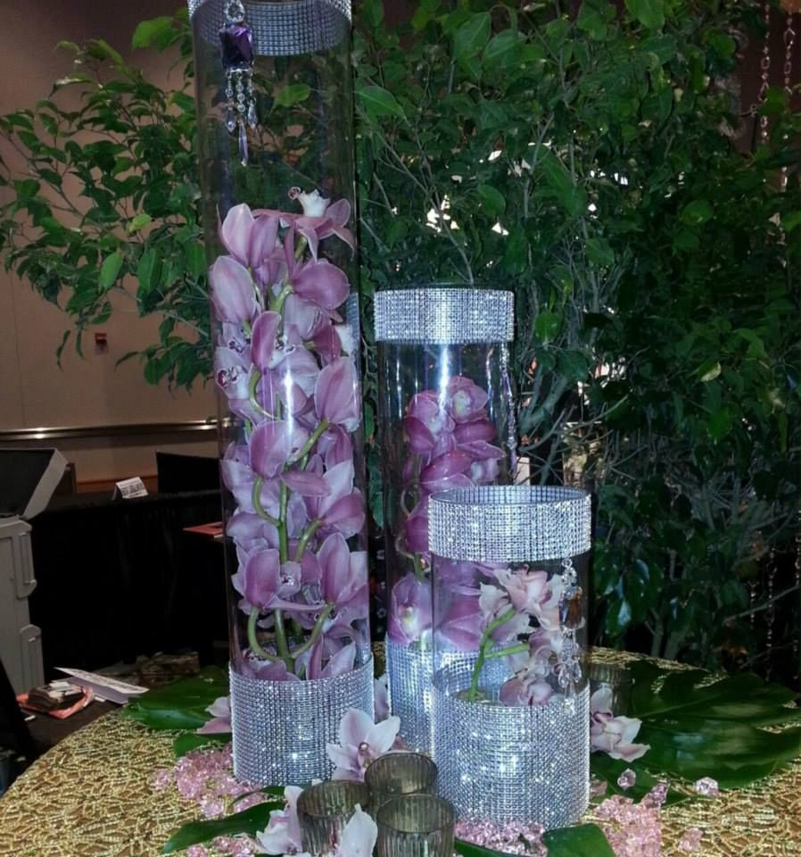 Orchids Submerged In Three Different Size Cylinder Vases for dimensions 898 X 960