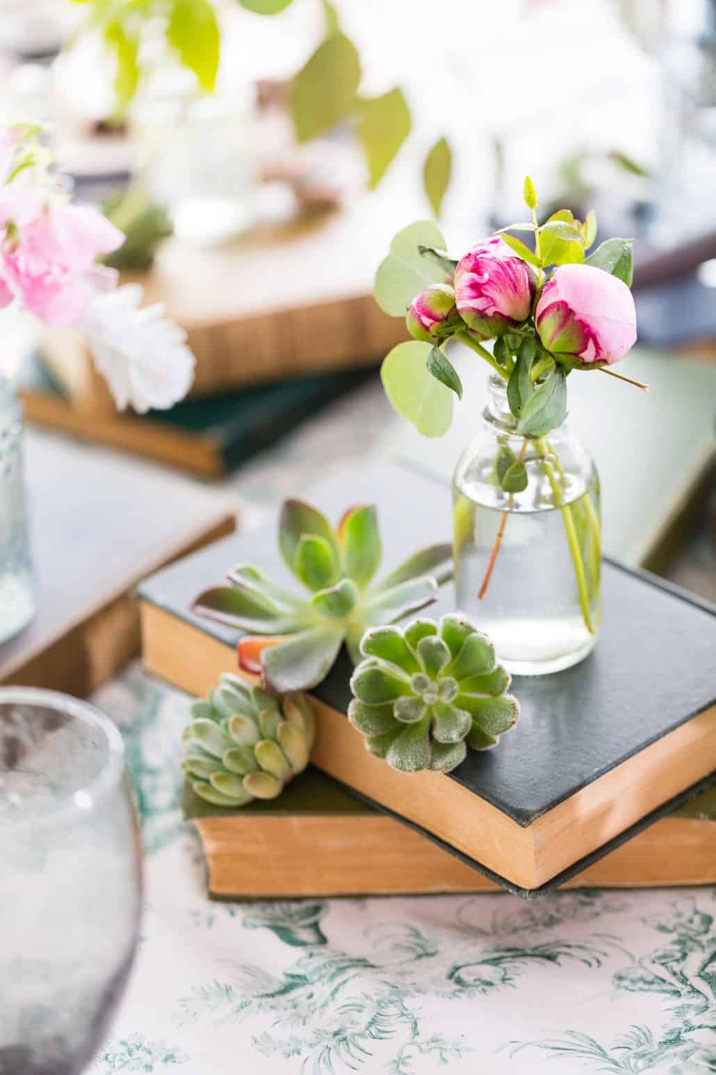 Pink Flower Buds In Bud Vase On Stacked Books Surrounded intended for measurements 1030 X 1545