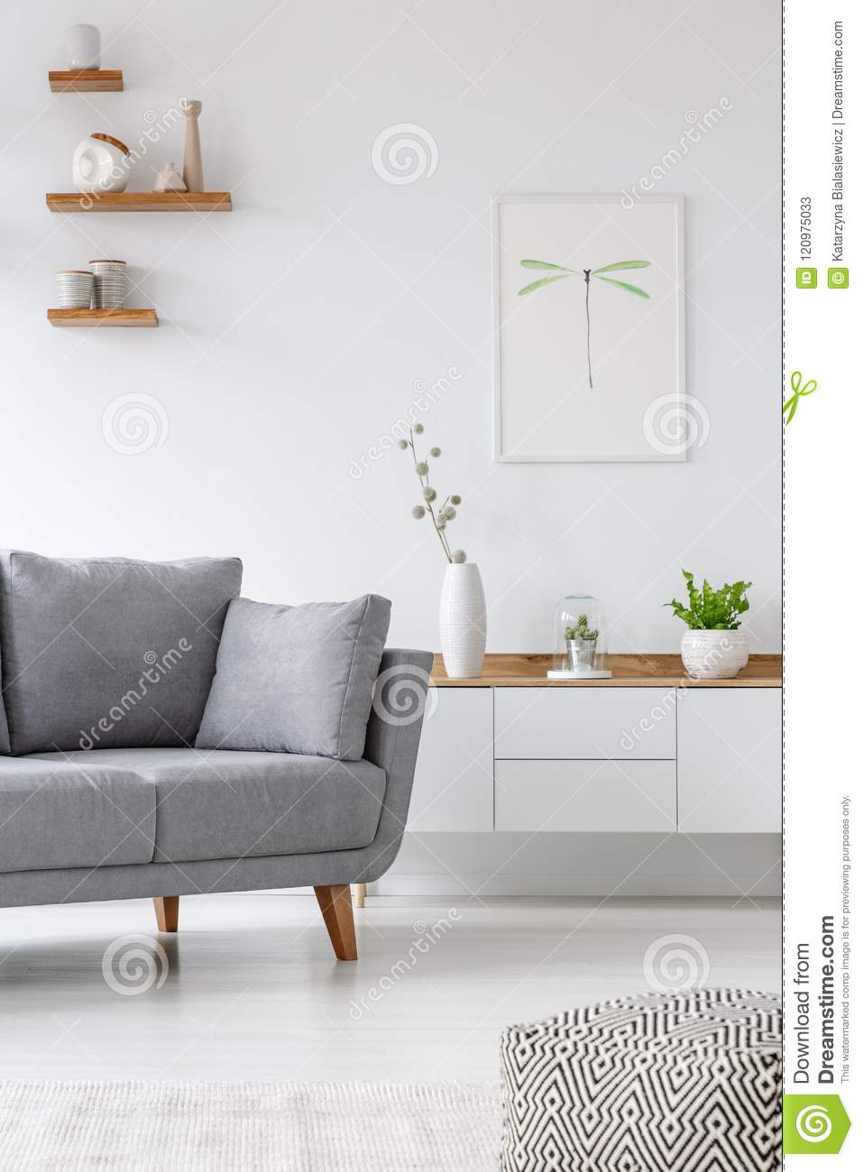 Real Photo Of A Grey Couch Standing Next To A Cupboard With intended for dimensions 957 X 1300