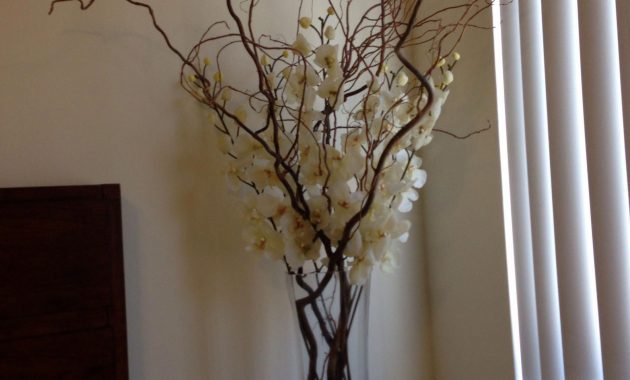 Silk Ivory Orchids With Large Branches In A Tall Rectangular for size 2448 X 3264