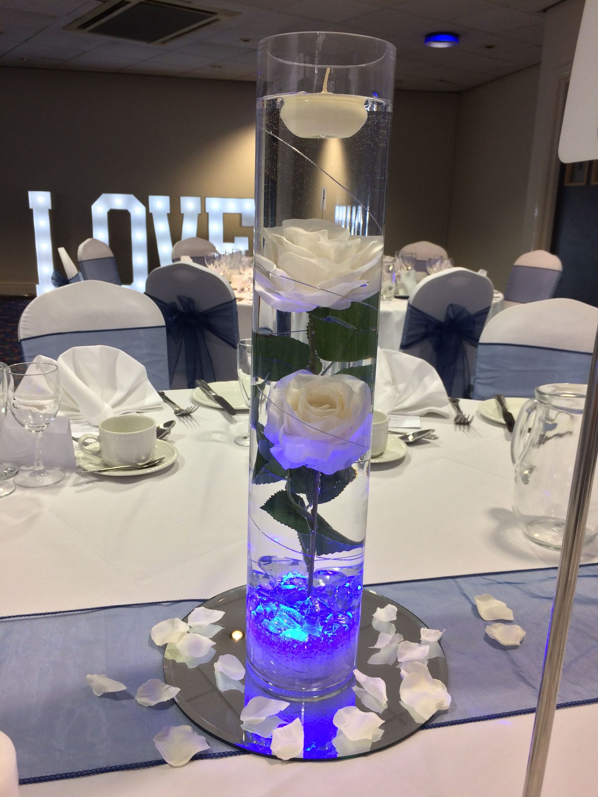 Tall Cylinder Vase Centrepiece With White Roses Submerged In for sizing 2448 X 3264