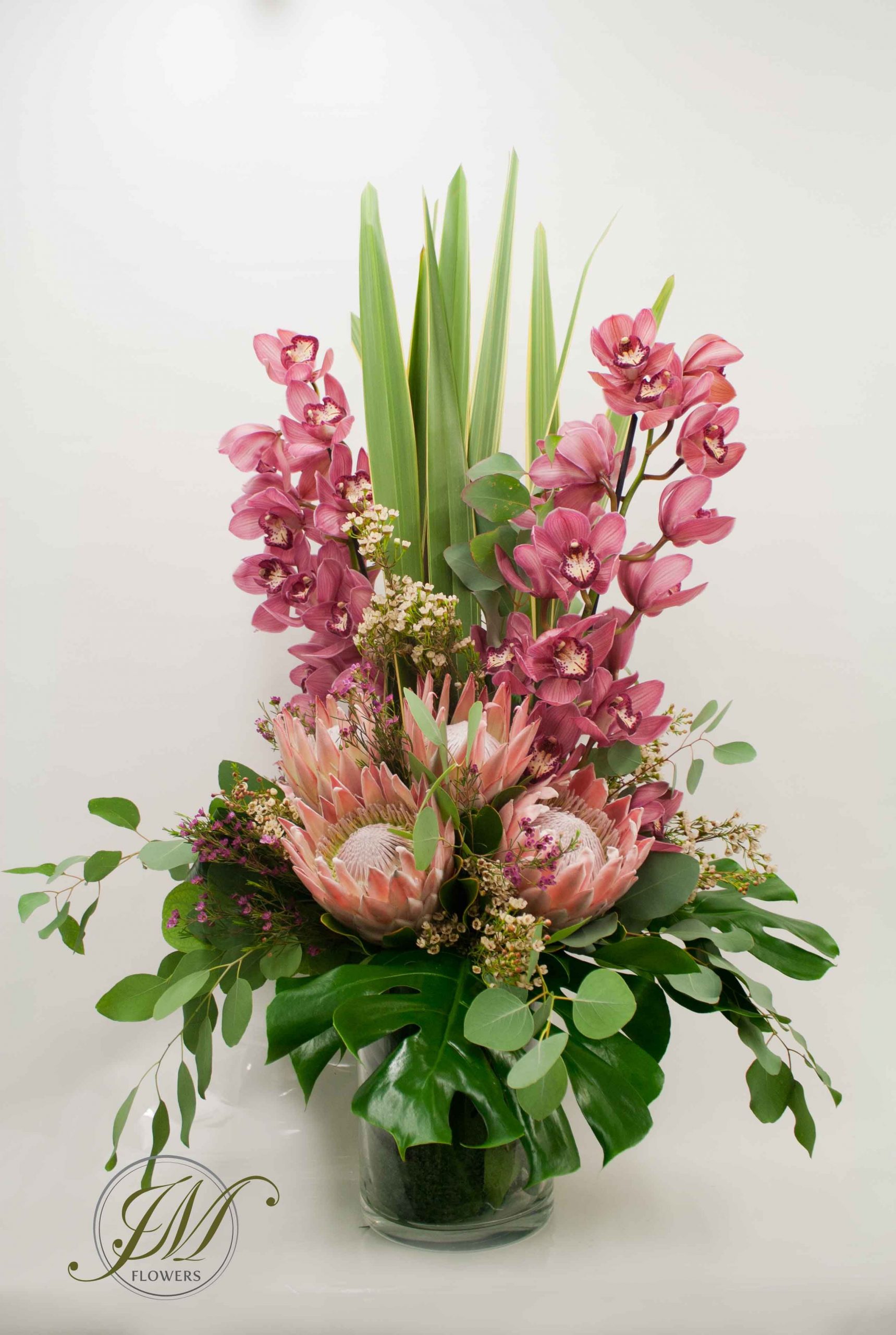 Tall Vase Display Made Of Cymbidium Orchids Proteas Wax throughout measurements 2565 X 3821