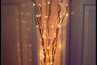 Twig Lights In Tall Vases Filled With Orchids And Peacock intended for measurements 776 X 1020