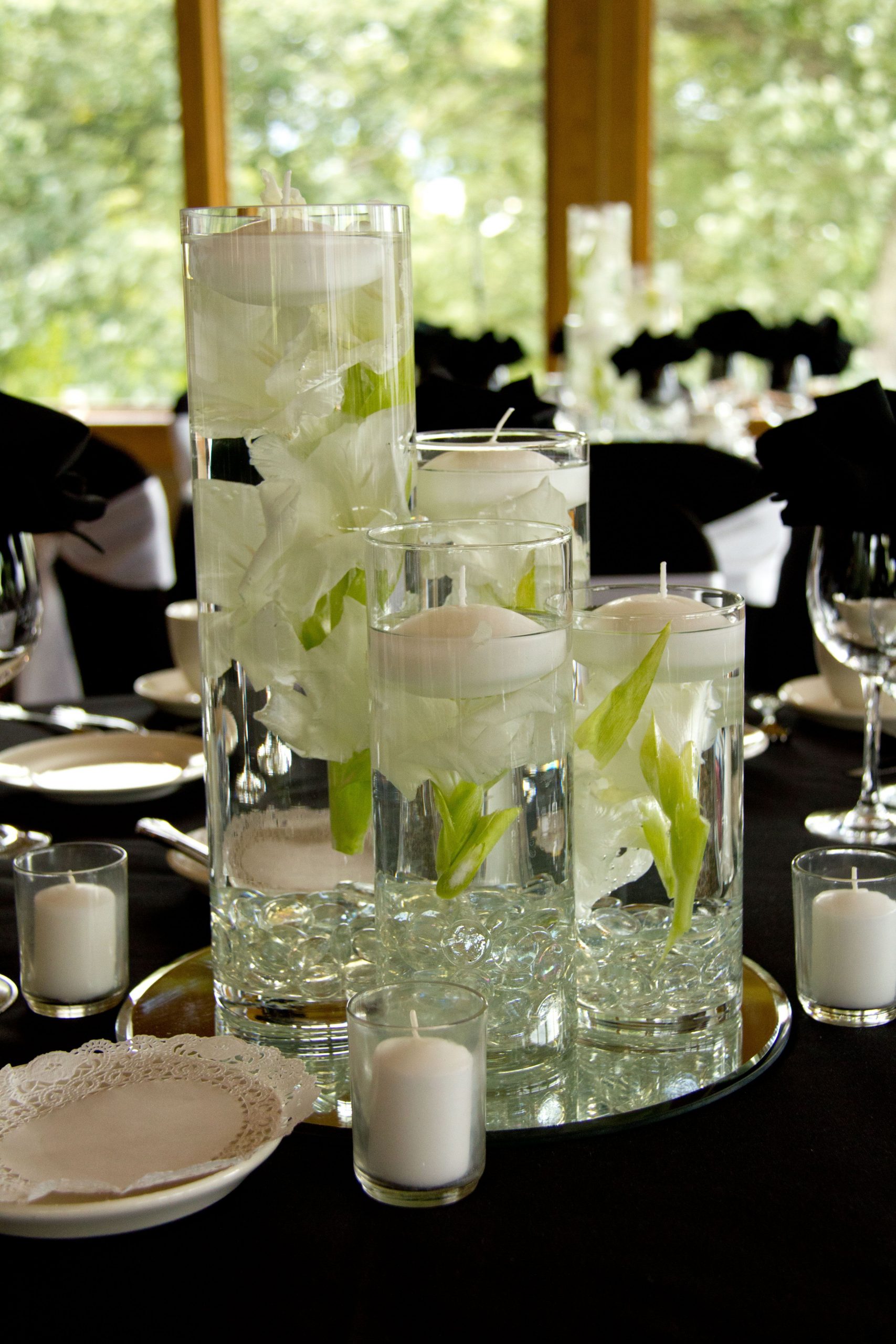 Varying Heights Of Cylinder Vases With Floating Flowers with regard to size 3456 X 5184