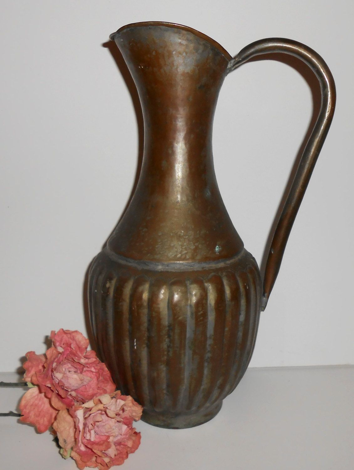 Antique brass water pitcher